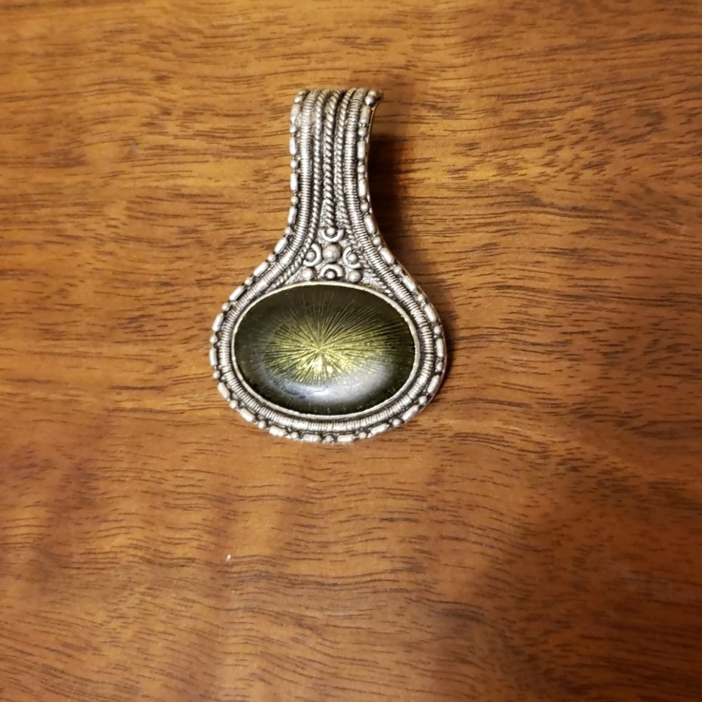 Green and silver pendant.